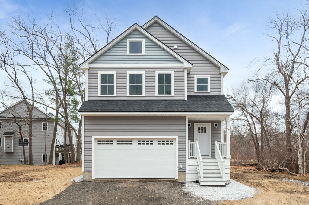 a front view of a house with a garage