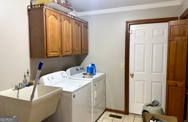 a front view of a house with a yard and outdoor seating