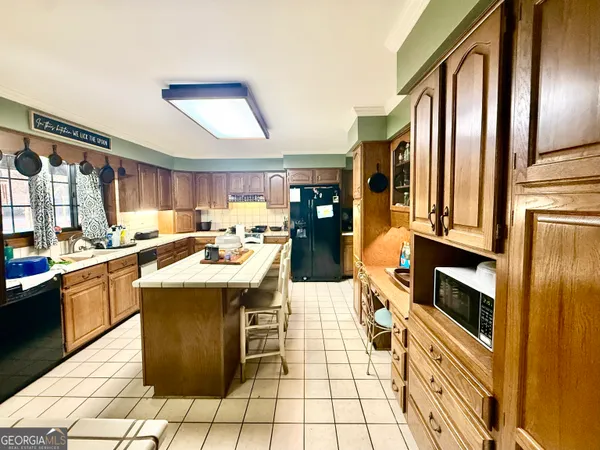 a kitchen with stainless steel appliances granite countertop a sink and counter space