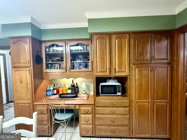 a kitchen with a refrigerator and table