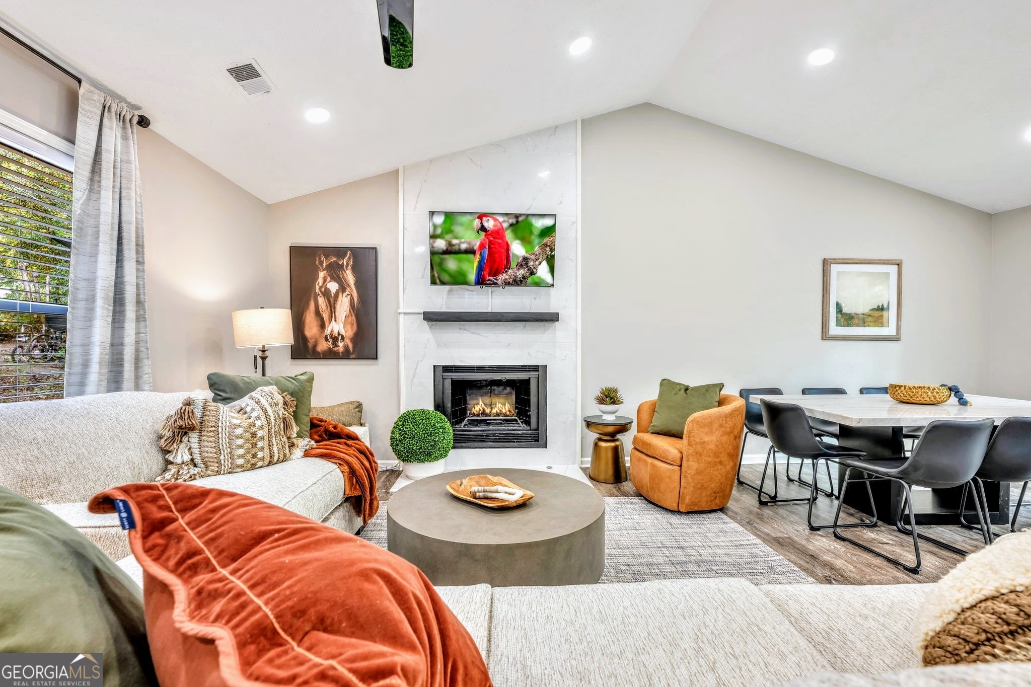a living room with furniture and a fireplace