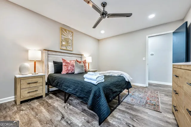 a bedroom with a bed and a dresser