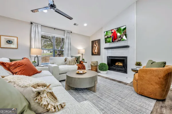 a living room with furniture and a fireplace