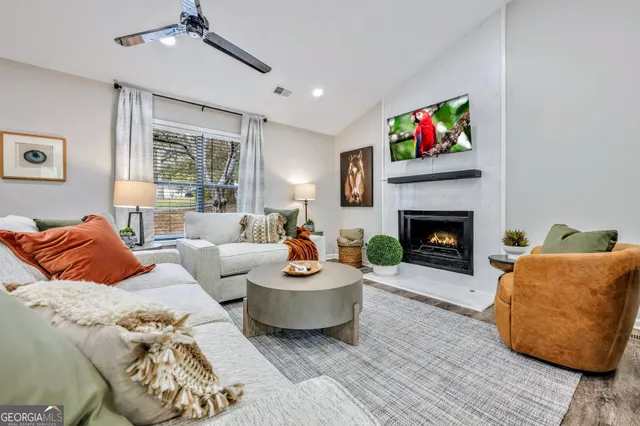 a living room with furniture and a fireplace