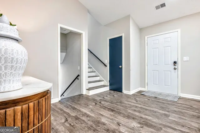 a view of entryway with wooden floor