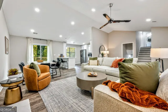 a living room with furniture and a large window