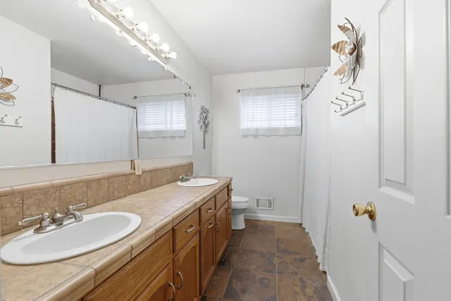 a bed room with a bed and a window