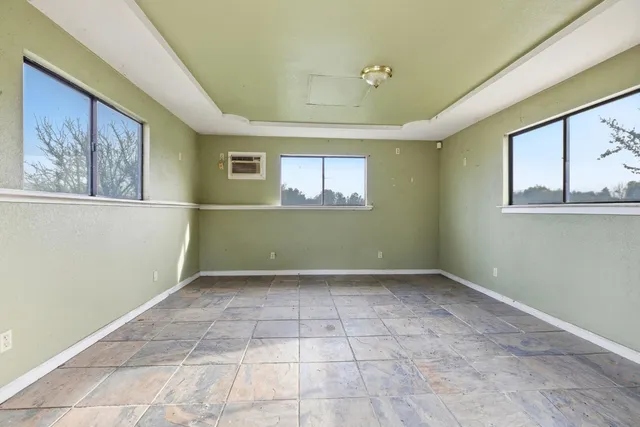 a view of steet with a table and chairs