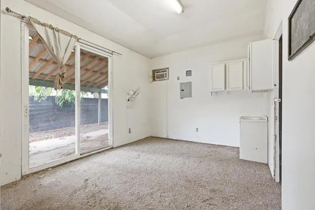 an aerial view of a residential houses with yard