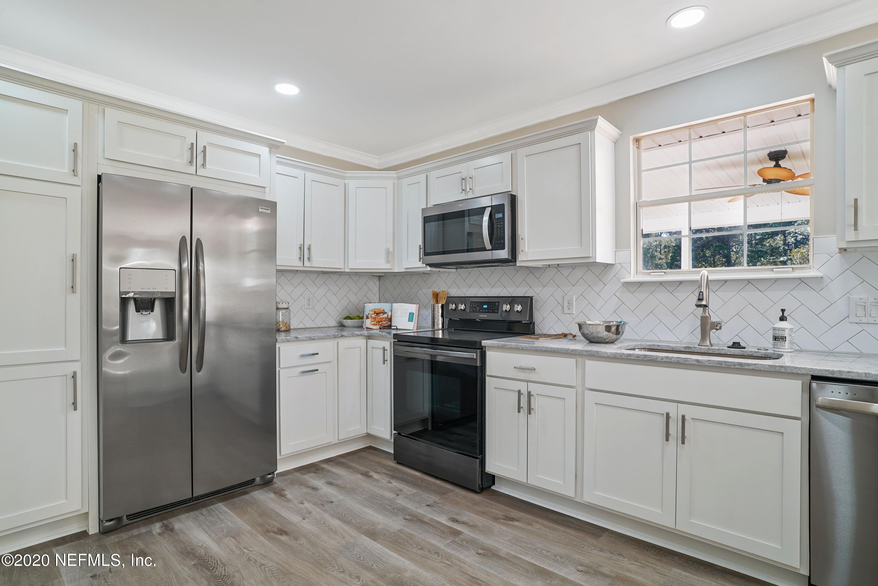 1342 Marlee Road St. Johns, FL 32259 - Photo 3 of 45 a kitchen with a refrigerator stove and sink