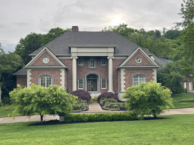 a front view of a house with a yard