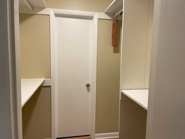 a bathroom with a shower and a sink