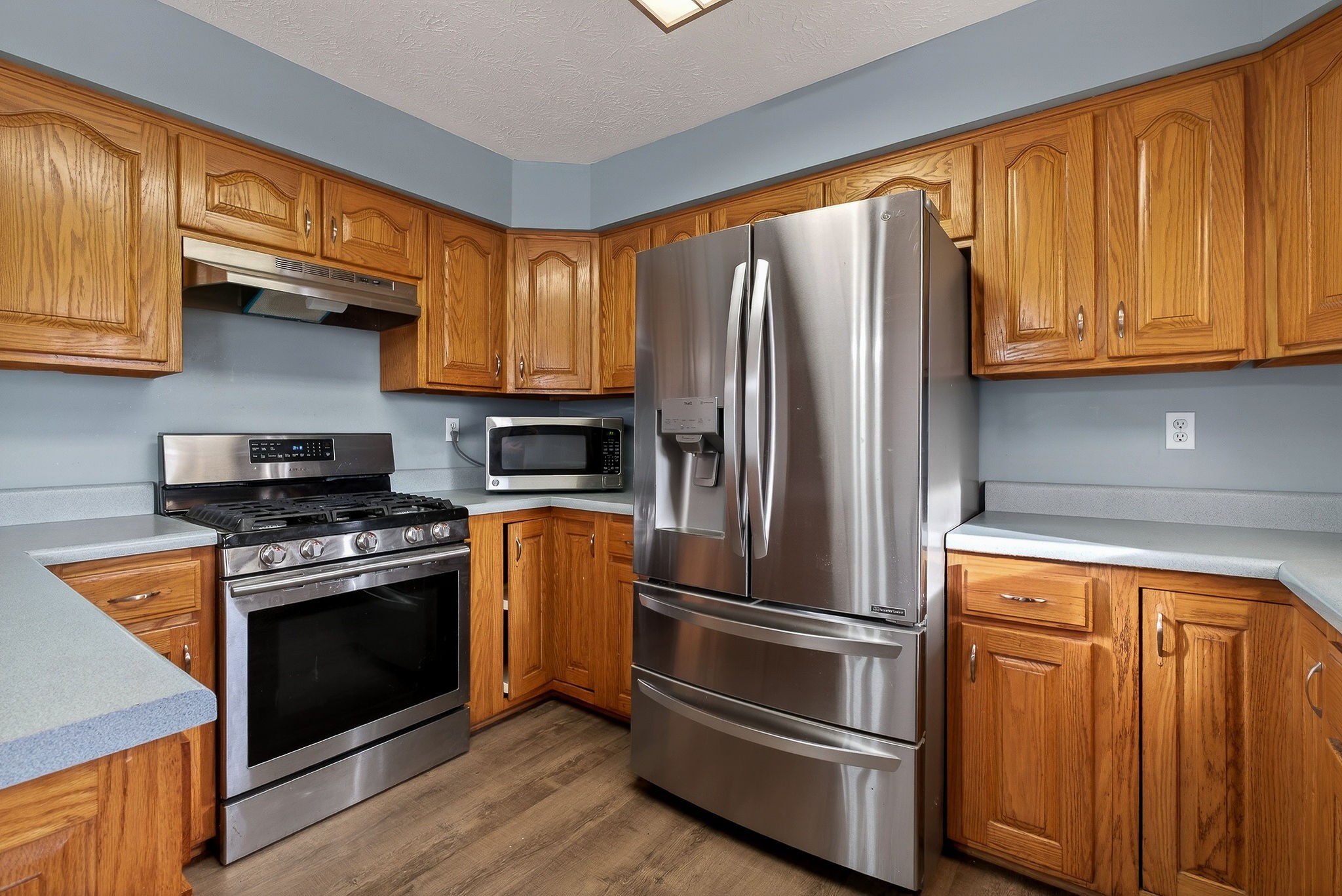 8607 Bockman Way Sparta, TN 38583 - Photo 13 of 34 a kitchen with stainless steel appliances granite countertop a refrigerator stove and sink