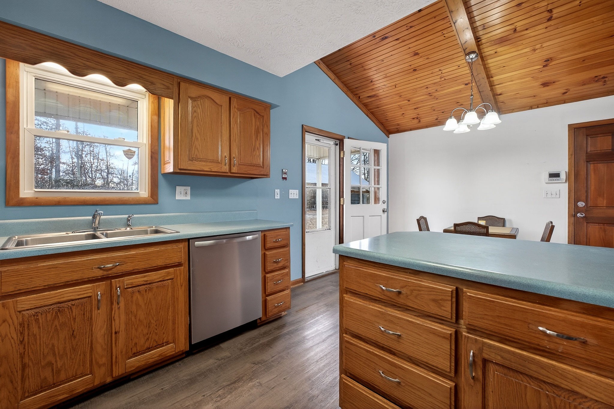 8607 Bockman Way Sparta, TN 38583 - Photo 14 of 34 a kitchen with stainless steel appliances granite countertop wooden cabinets a sink and dishwasher