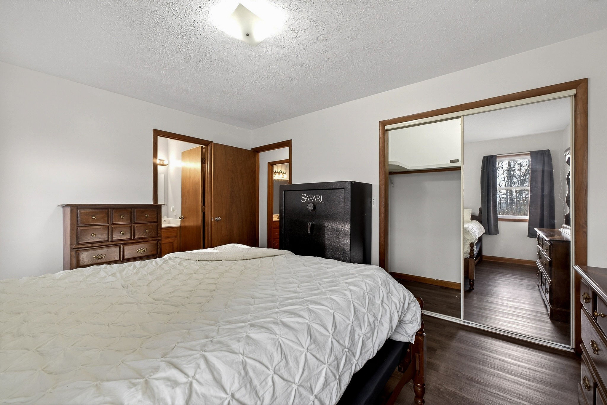 8607 Bockman Way Sparta, TN 38583 - Photo 16 of 34 a large bedroom with a bed and wooden floor