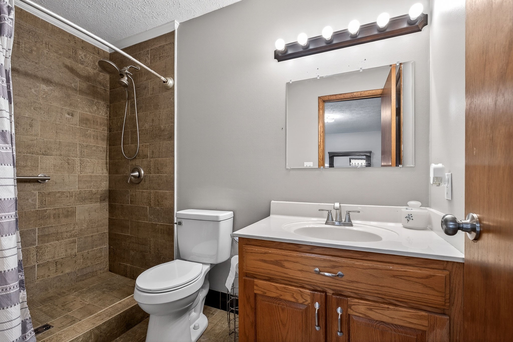 8607 Bockman Way Sparta, TN 38583 - Photo 17 of 34 a bathroom with a sink mirror vanity and toilet