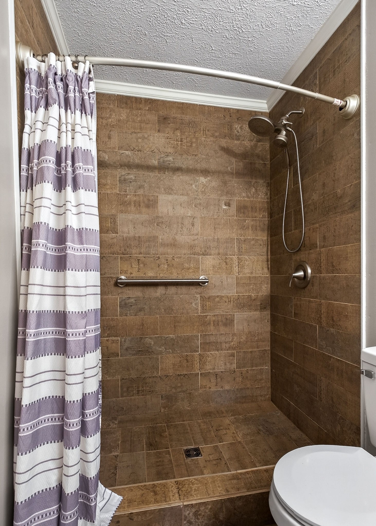 8607 Bockman Way Sparta, TN 38583 - Photo 18 of 34 a bathroom with a shower and toilet