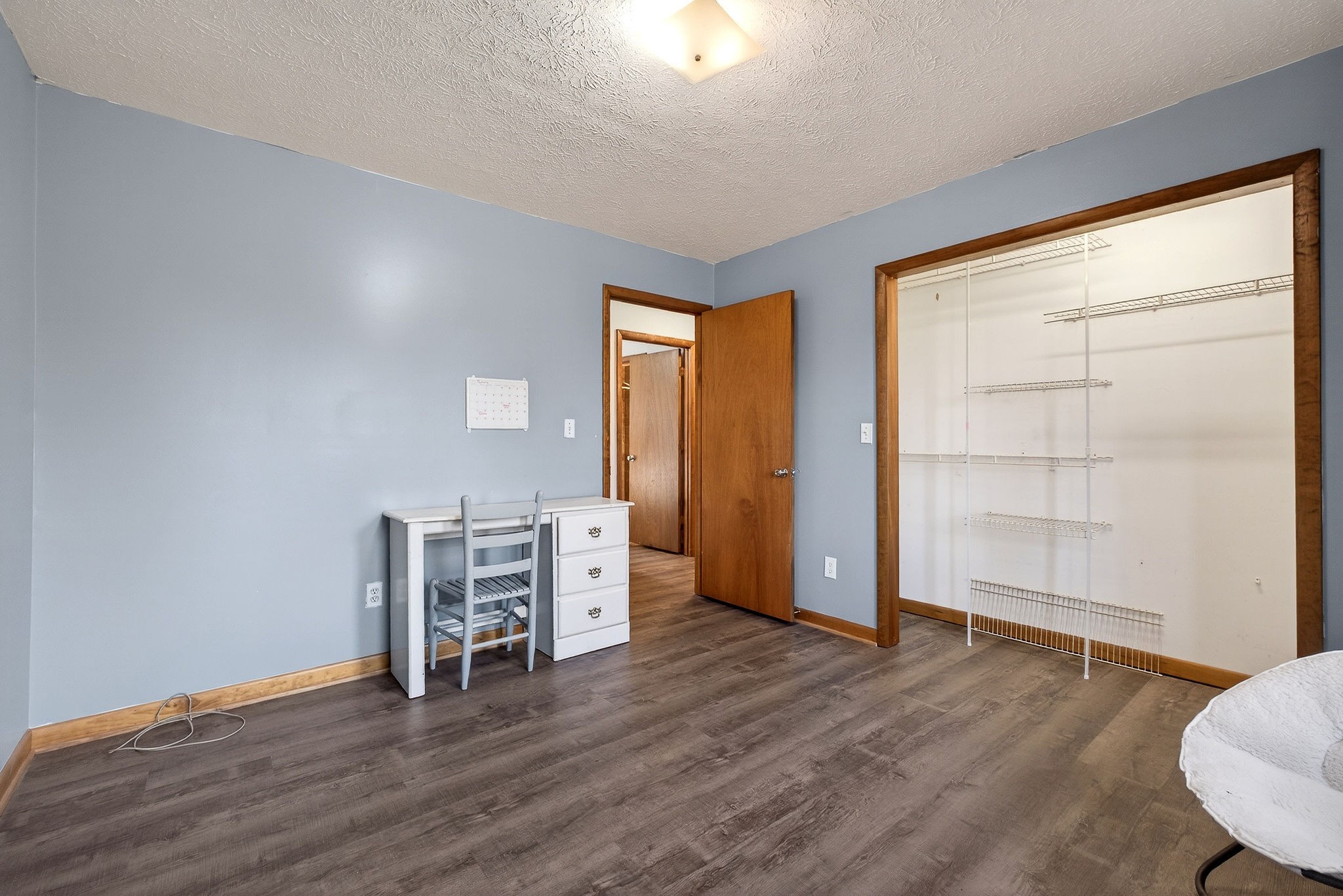 8607 Bockman Way Sparta, TN 38583 - Photo 20 of 34 a view of an empty room with wooden floor and a window