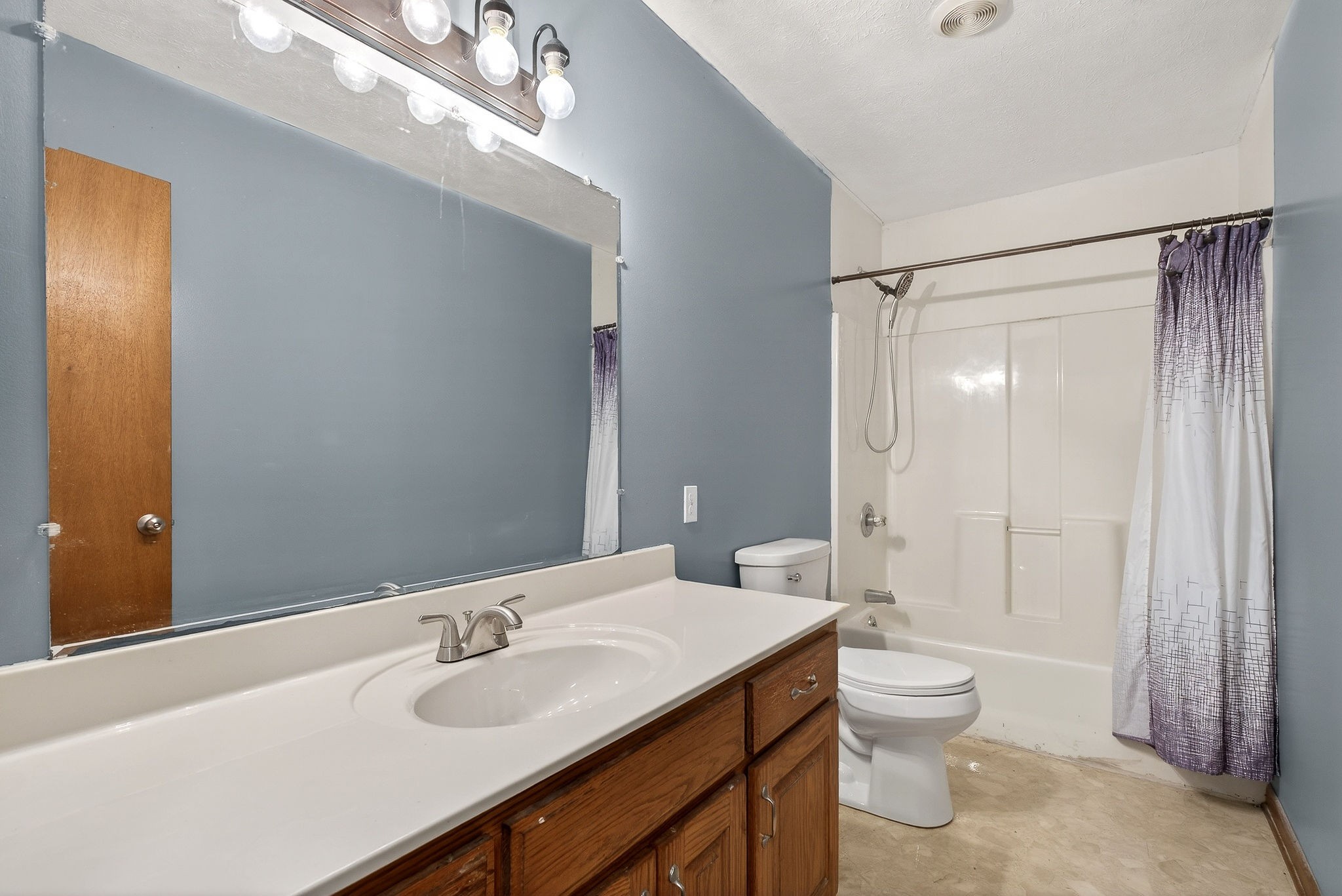 8607 Bockman Way Sparta, TN 38583 - Photo 21 of 34 a bathroom with a sink a toilet and shower