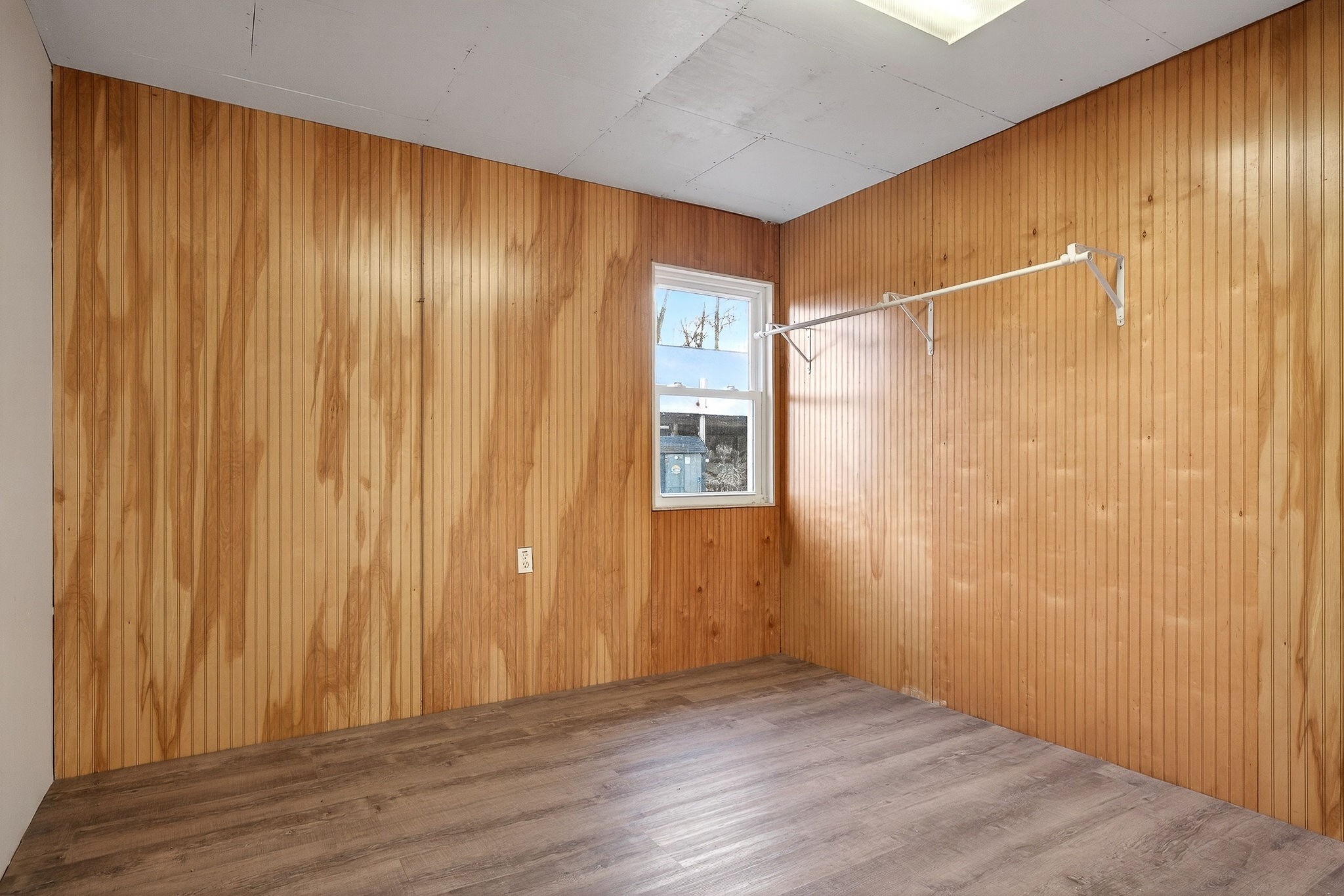 8607 Bockman Way Sparta, TN 38583 - Photo 23 of 34 a view of an empty room with wooden floor and a window