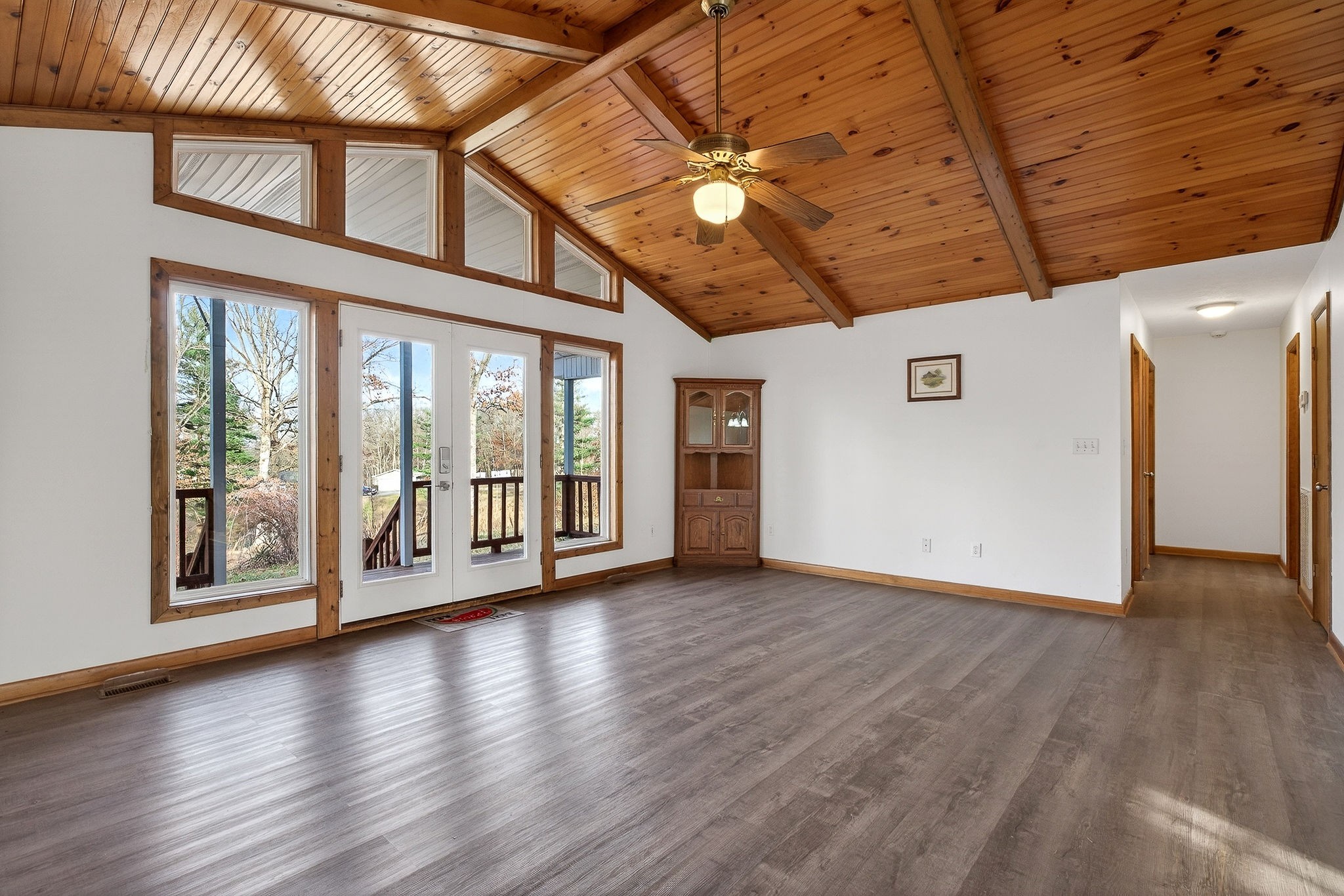 8607 Bockman Way Sparta, TN 38583 - Photo 7 of 34 a view of an empty room with wooden floor and a window
