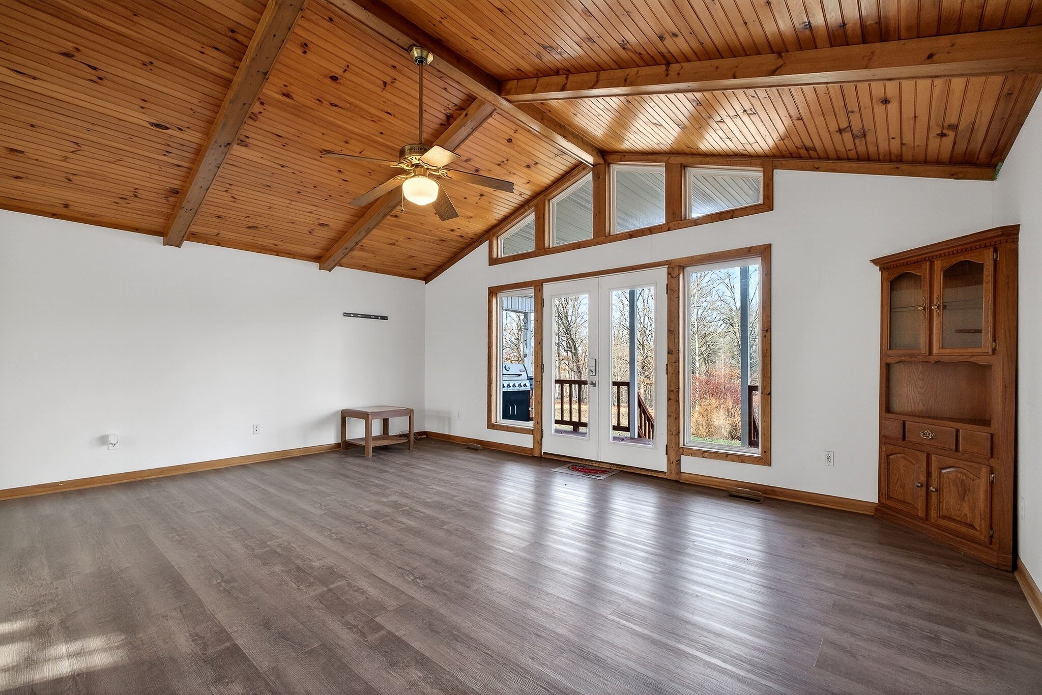 8607 Bockman Way Sparta, TN 38583 - Photo 8 of 34 a view of an empty room with wooden floor and a window