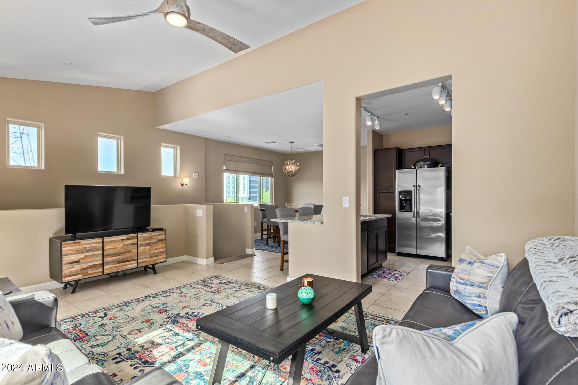 2150 West Alameda Road, Unit 1182 Phoenix, AZ 85085 - Photo 10 of 47 a living room with furniture and a flat screen tv