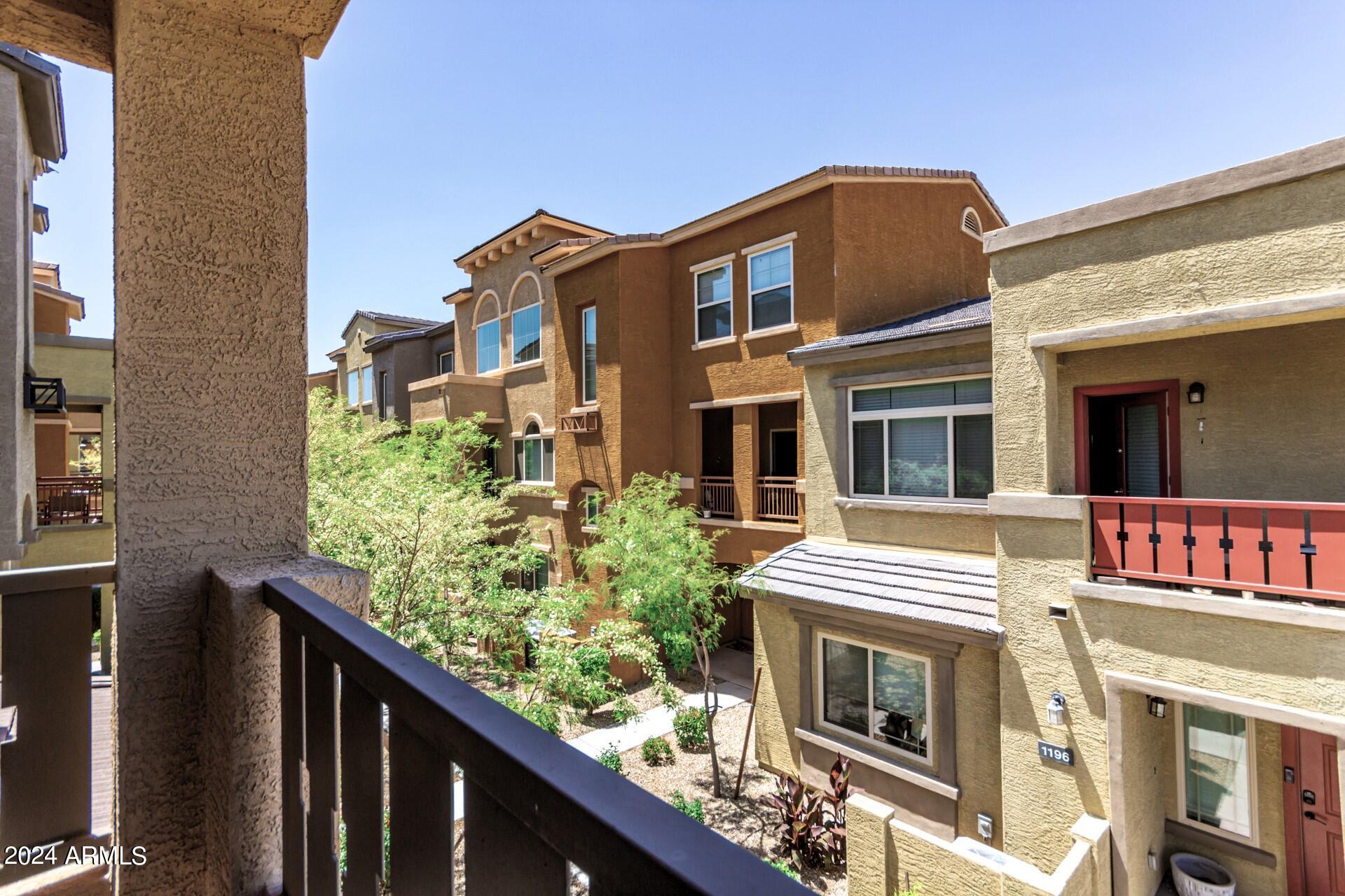 2150 West Alameda Road, Unit 1182 Phoenix, AZ 85085 - Photo 11 of 47 a front view of a multi story building