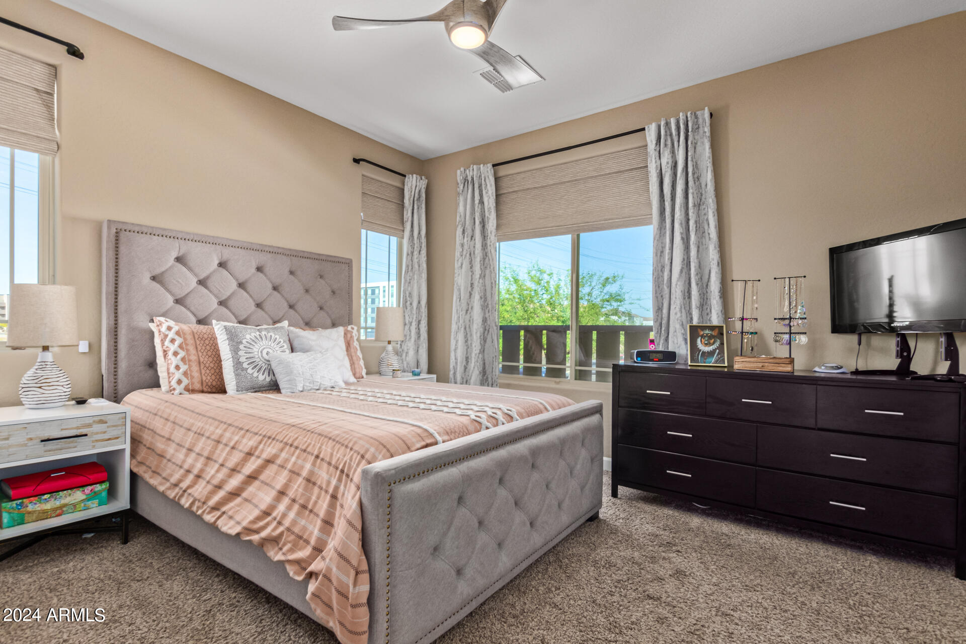 2150 West Alameda Road, Unit 1182 Phoenix, AZ 85085 - Photo 13 of 47 a bedroom with a bed window and a dresser