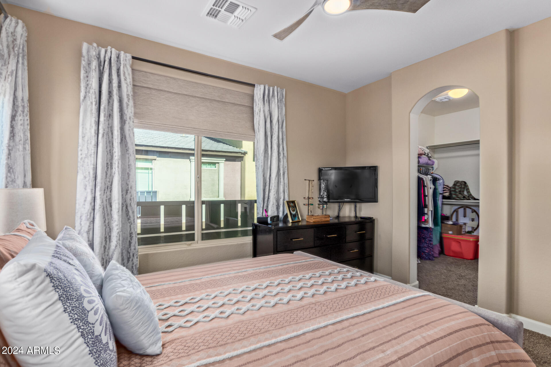 2150 West Alameda Road, Unit 1182 Phoenix, AZ 85085 - Photo 15 of 47 a bedroom with a bed and a television