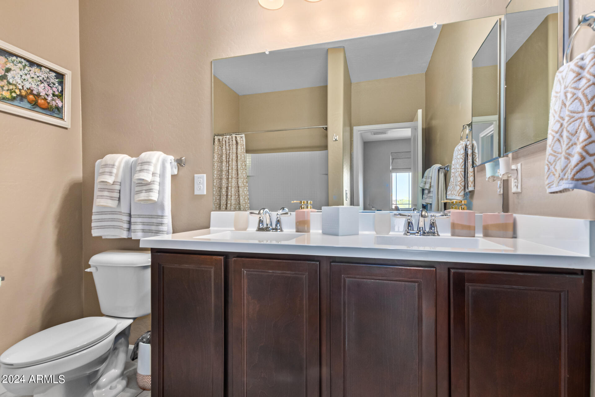 2150 West Alameda Road, Unit 1182 Phoenix, AZ 85085 - Photo 17 of 47 a bathroom with a toilet a sink and mirror