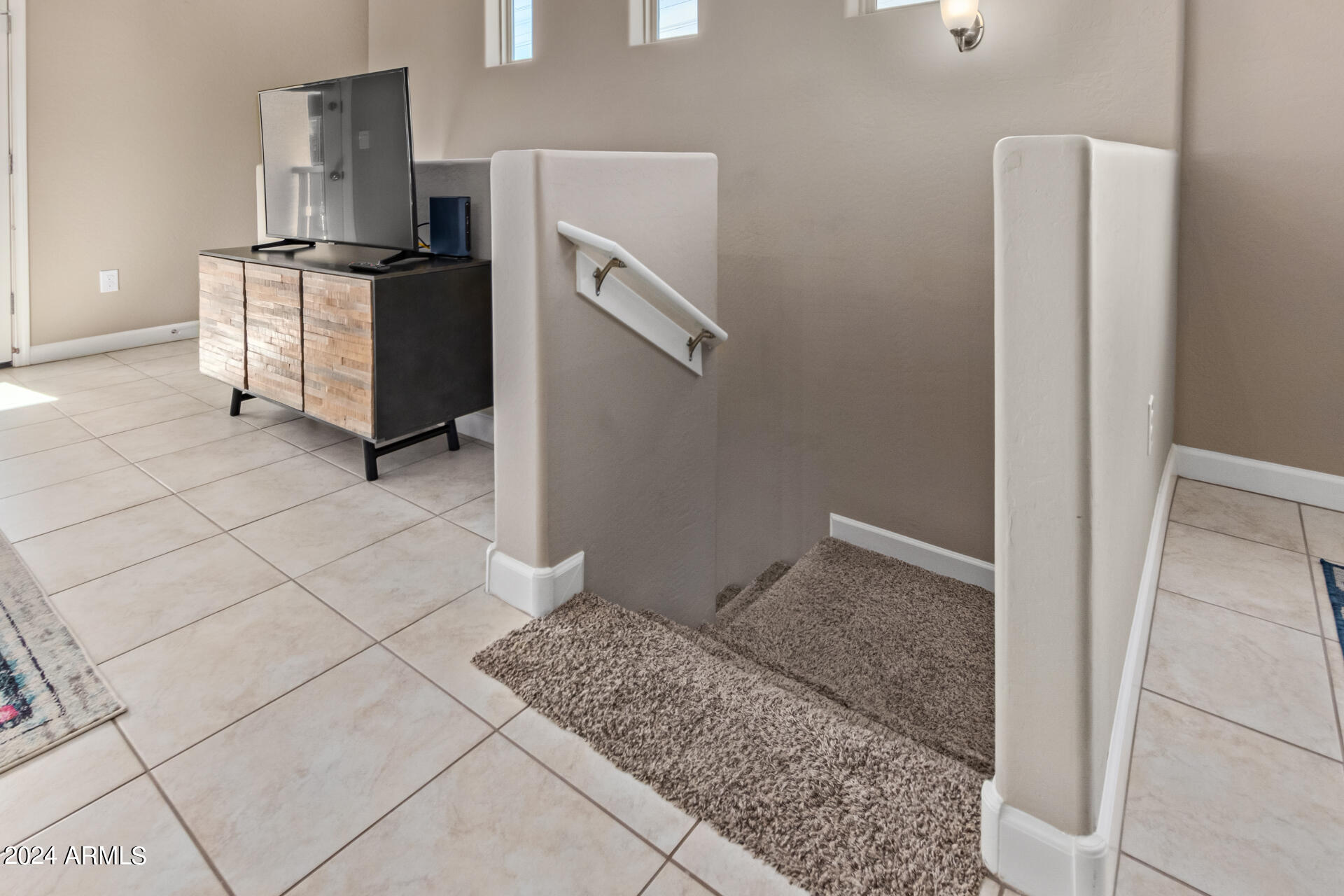 2150 West Alameda Road, Unit 1182 Phoenix, AZ 85085 - Photo 19 of 47 a kitchen with a refrigerator and cabinets