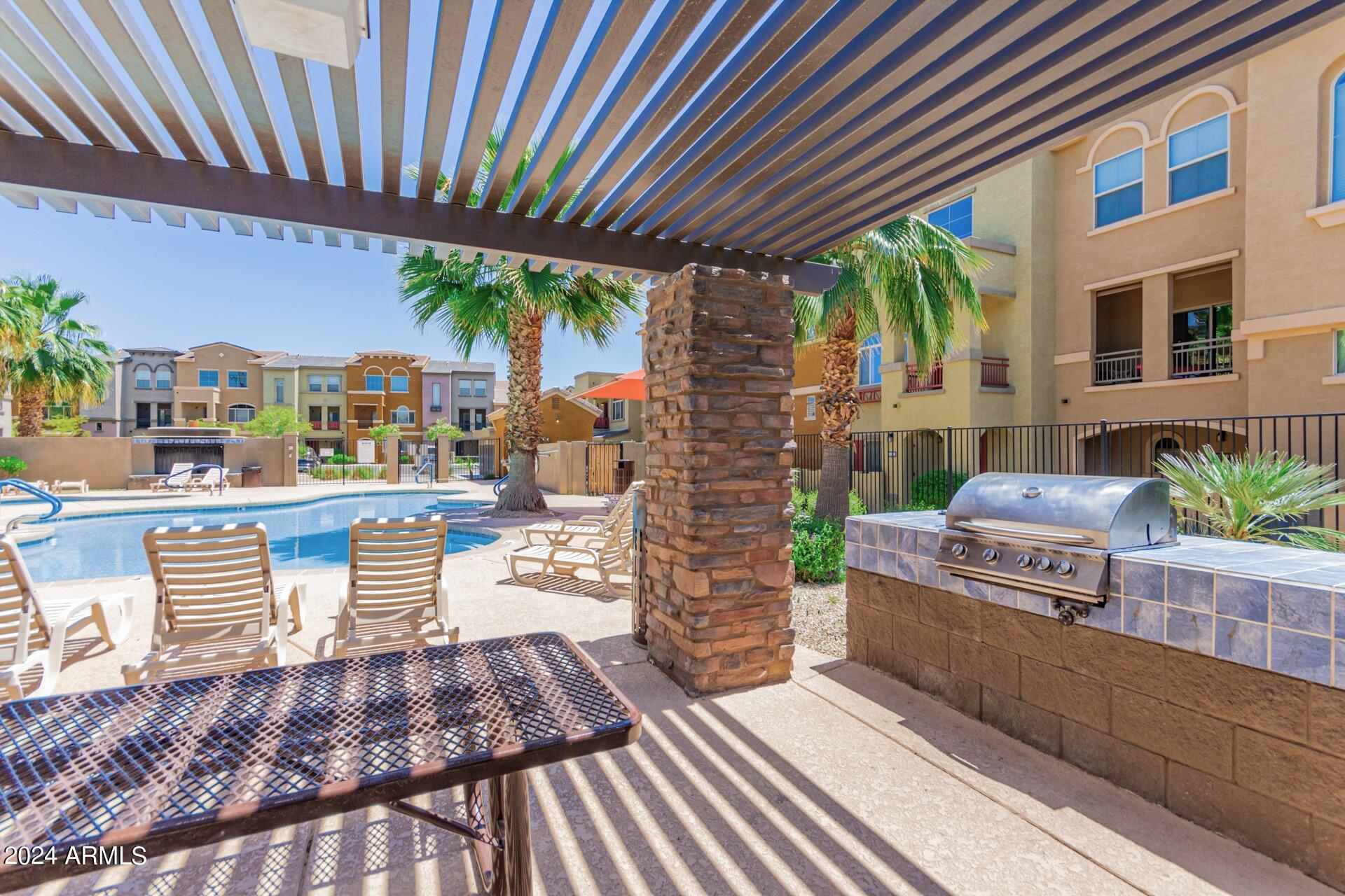 2150 West Alameda Road, Unit 1182 Phoenix, AZ 85085 - Photo 32 of 47 a living room filled with furniture and a fireplace