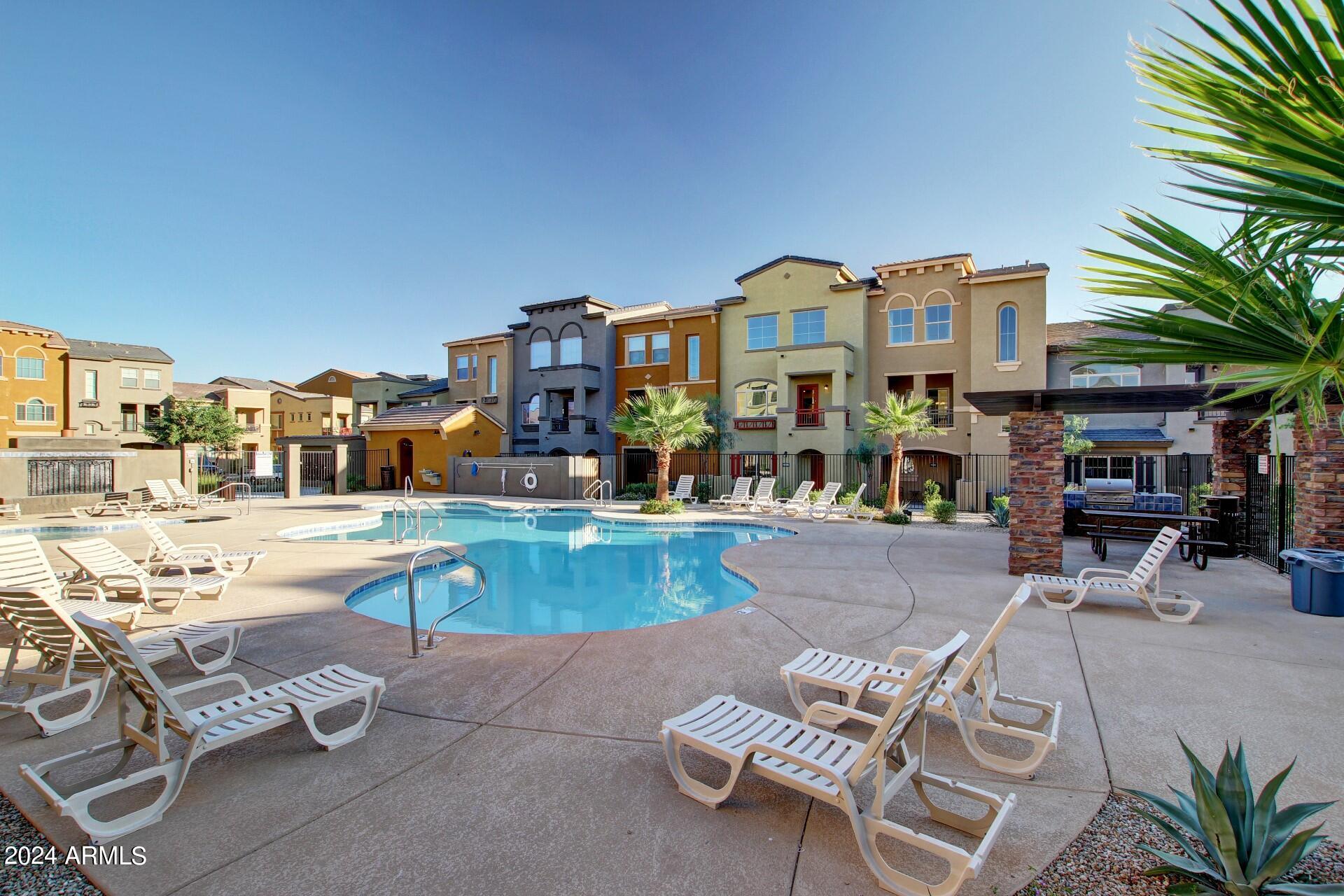 2150 West Alameda Road, Unit 1182 Phoenix, AZ 85085 - Photo 44 of 47 a view of a swimming pool with outdoor seating