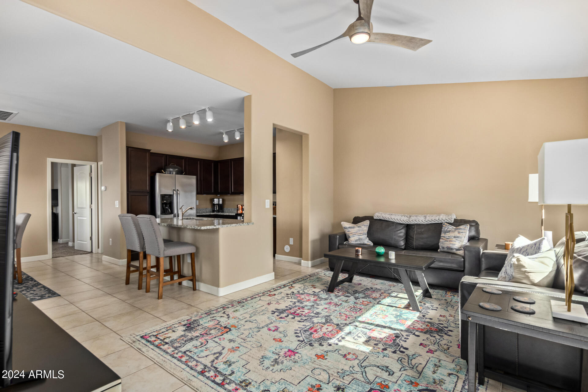 2150 West Alameda Road, Unit 1182 Phoenix, AZ 85085 - Photo 9 of 47 a living room with furniture and view of kitchen