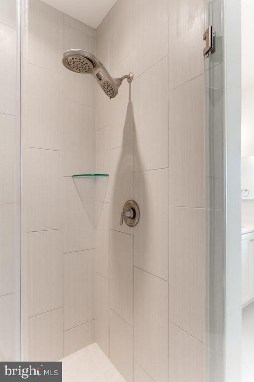 944 Lindley Road Frederick, MD 21701 - Photo 29 of 58 Floor-to-ceiling tiled shower w/ frameless door