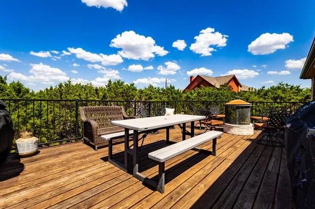a bedroom with a bed table and chair