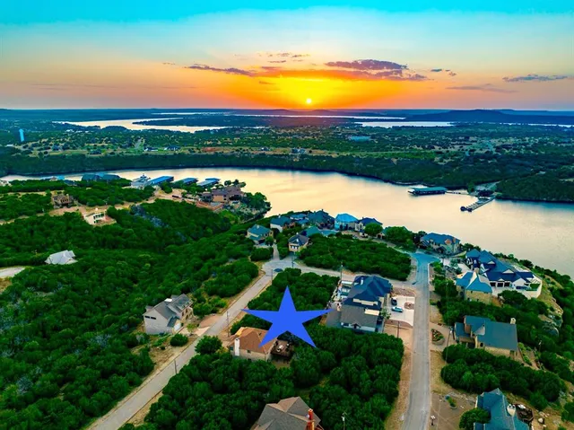 an aerial view of a house with a ocean view