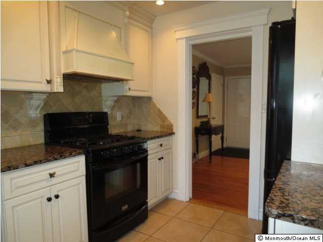 10 Fairmount Road Holmdel, NJ 07733 - Photo 3 of 3 a kitchen with granite countertop a stove and a sink
