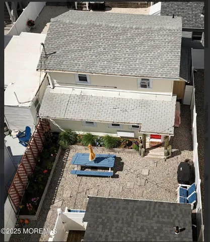 an aerial view of a house with sitting area