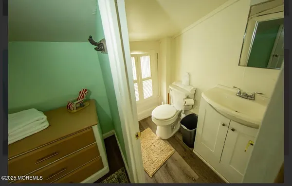 a bathroom with a sink and toilet