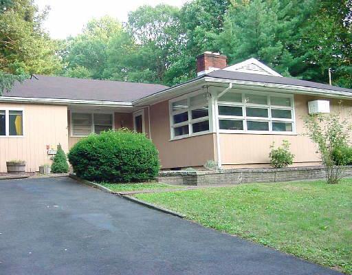 56 Mcguire Road Trumbull, CT 06611 - Photo 1 of 1 a front view of house with yard and green space