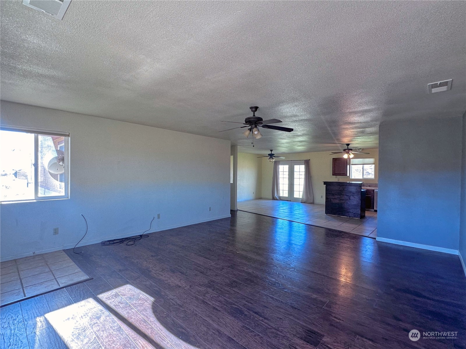 19 Jess Botello Place Riverside, WA 98849 - Photo 6 of 30 wooden floor in an empty room with a window