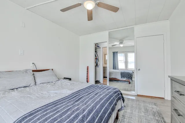 a view of walk in closet with clothes