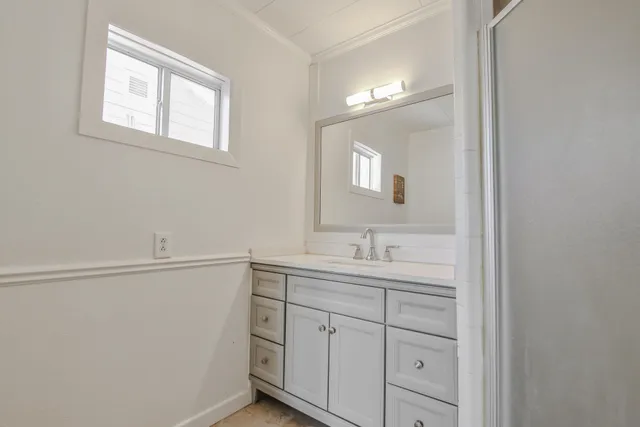 a view of walk in closet with white walls