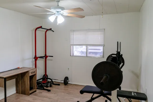 a room with a table and chandelier