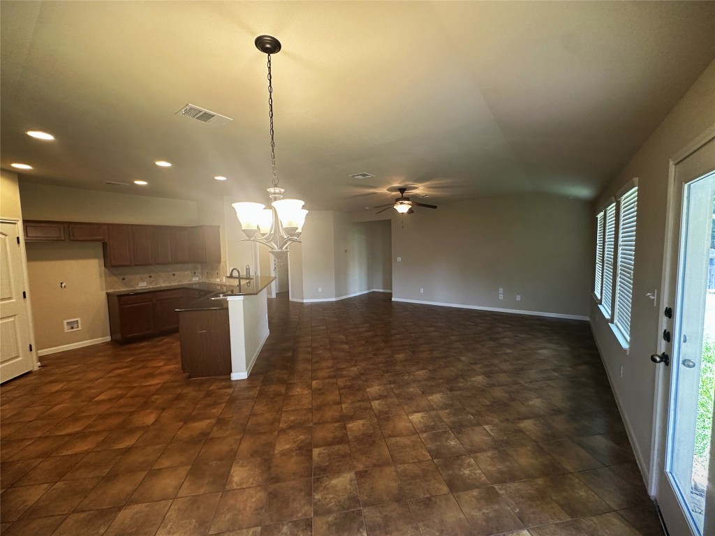 7714 Squirrel Hollow Drive Georgetown, TX 78628 - Photo 17 of 17 a view of a room with a kitchen