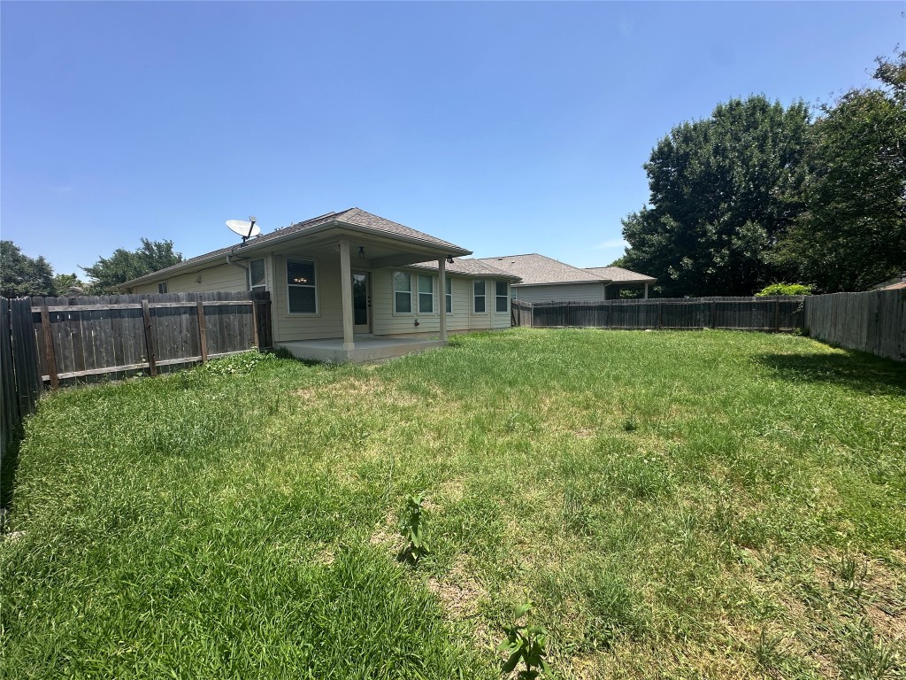 7714 Squirrel Hollow Drive Georgetown, TX 78628 - Photo 16 of 17 a front view of a house with garden