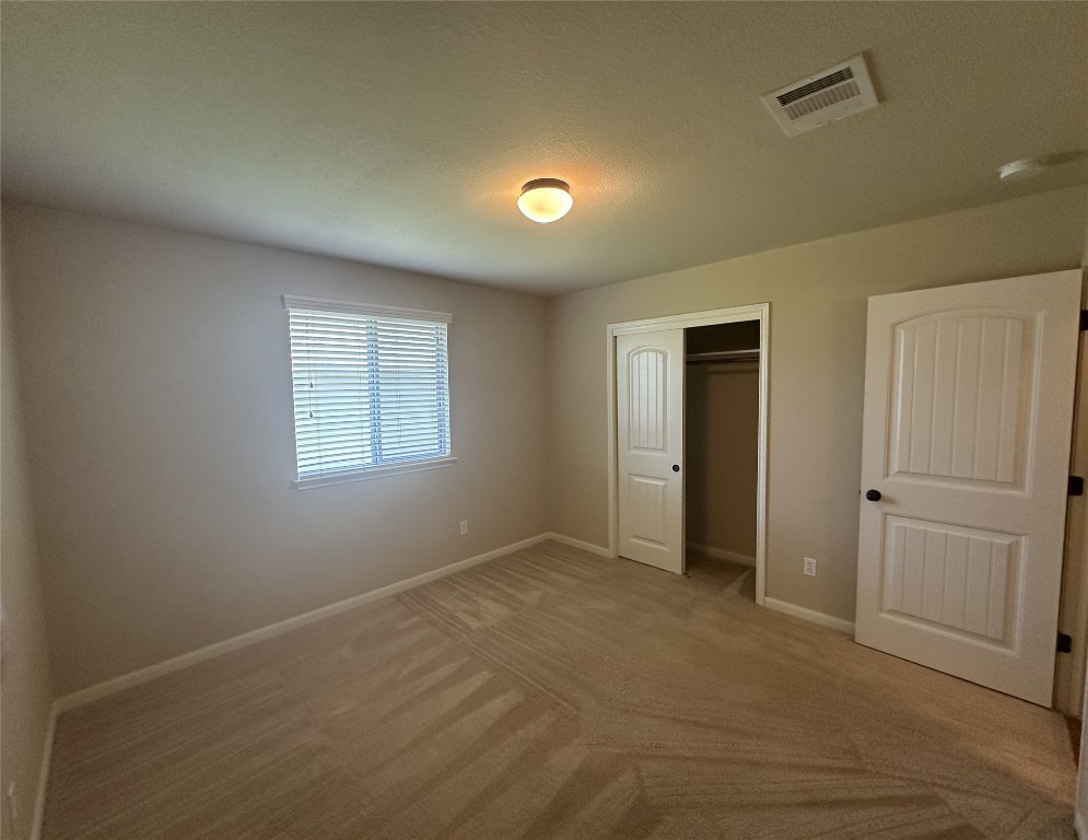 7714 Squirrel Hollow Drive Georgetown, TX 78628 - Photo 4 of 17 a view of an empty room with a window