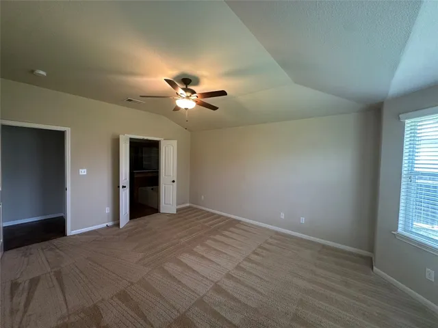 a view of an empty room with a window